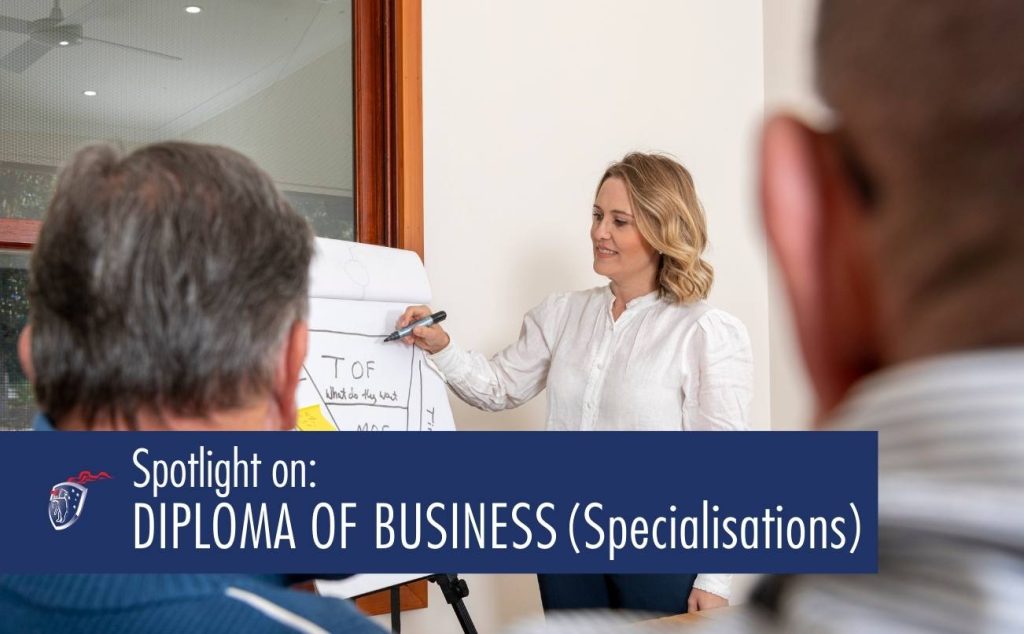 Business woman drawing on flip chart in front of boardroom