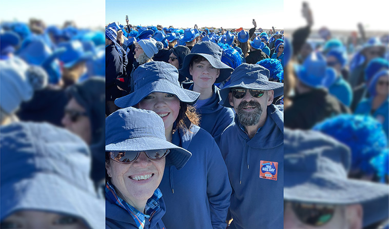 Family dressed in blue in crowd